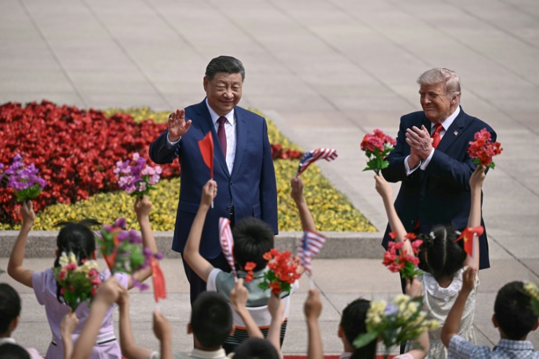 Les présidents chinois Xi Jinping (g) et américain Donald Trump, le 14 mai 2026 à Pékin