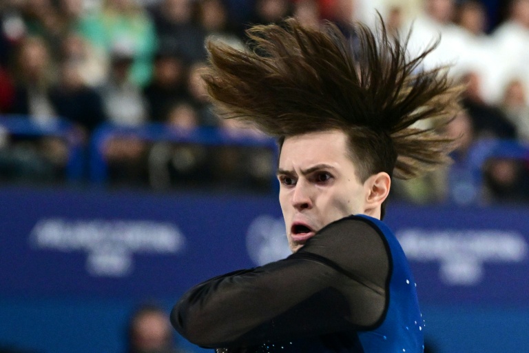 Mikhail Shaidorov lors de son programme libre de patinage artistique le 13 février 2026 sur la patinoire de Milan
où le Kazakhstanais a été sacré champion olympique au terme d'une soirée où le favori américain Ilia Malinin est passé au travers
