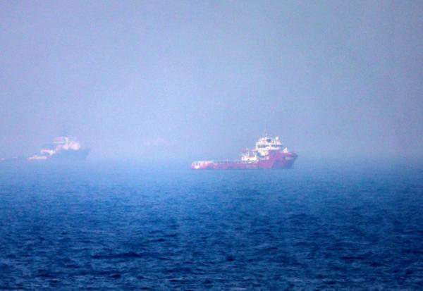 Des navires dans le détroit d'Ormuz, au large de Khor Fakkan, aux Emirats arabes unis, le 13 juillet 2026