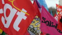 Les drapeaux de différents syndicats lors d'une manifestation, à Reims, le 15 mars 2023