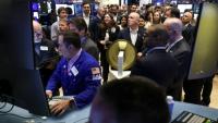 Des traders à la bourse de New York (NYSE), le 12 mars 2026
