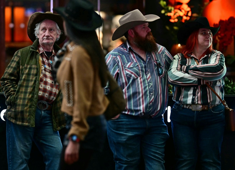 Des fans de musique country participent au festival Country to Country (C2C), le 13 mars 2026 à Londres