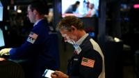 Des opérateurs à la Bourse de New York, le 5 août 2025